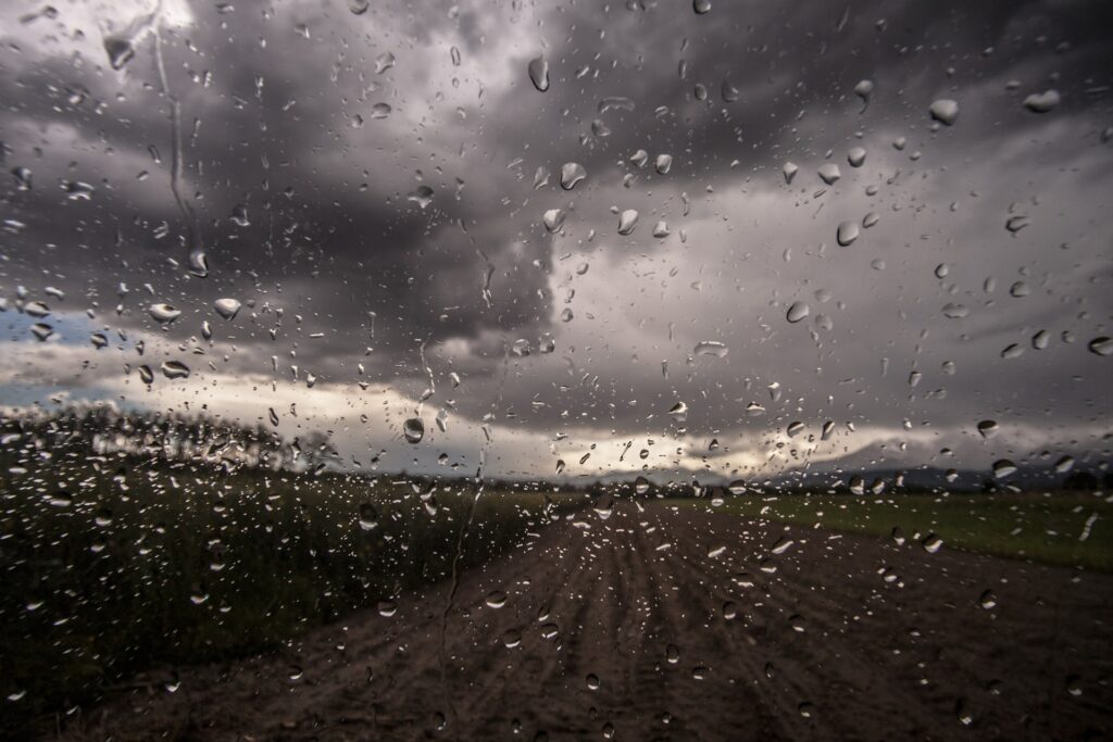 Image used under a Collective Commons License from https://pixabay.com/photos/window-raindrops-rain-clouds-dark-407206/